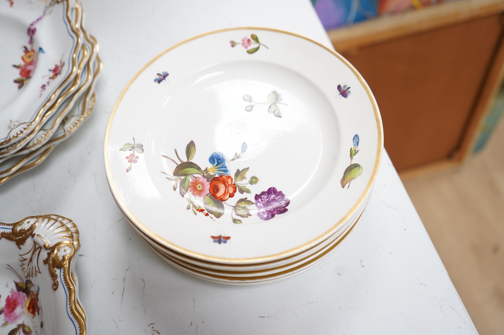 A set of six early 19th century Spode floral dessert plates, and an English porcelain part dessert service, c.1835, largest 22cm in diameter
